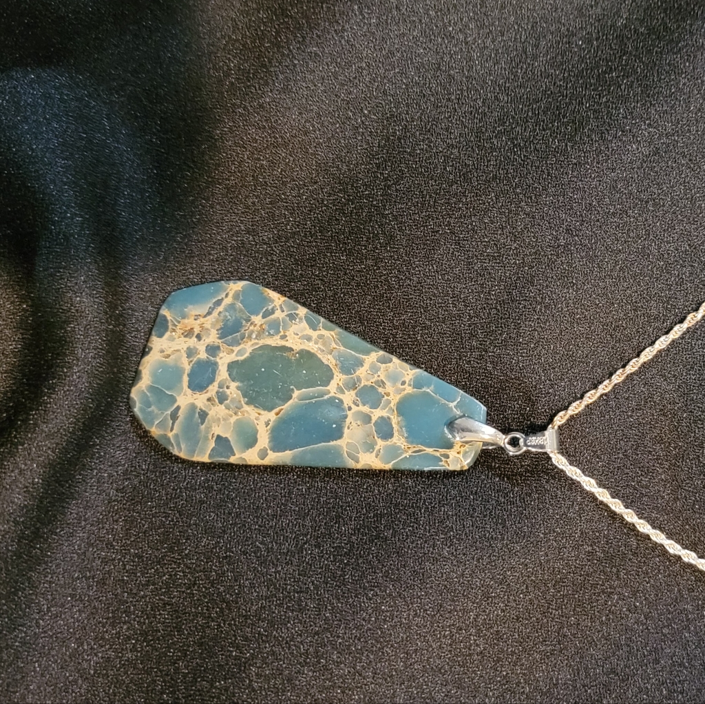 Woman's Necklace With Triangular Thin Stone.